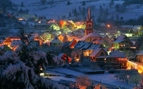 在冬季傍晚壁纸和背景图像点燃的村庄
